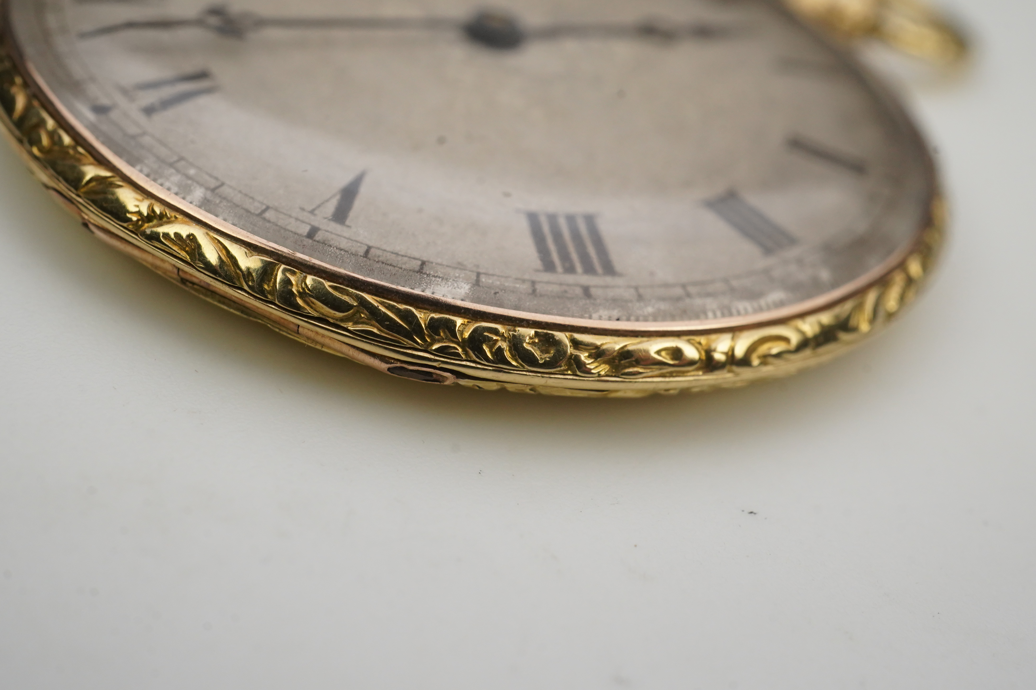 A lady's 19th century Swiss 18ct gold open faced key wind cylinder dress pocket watch